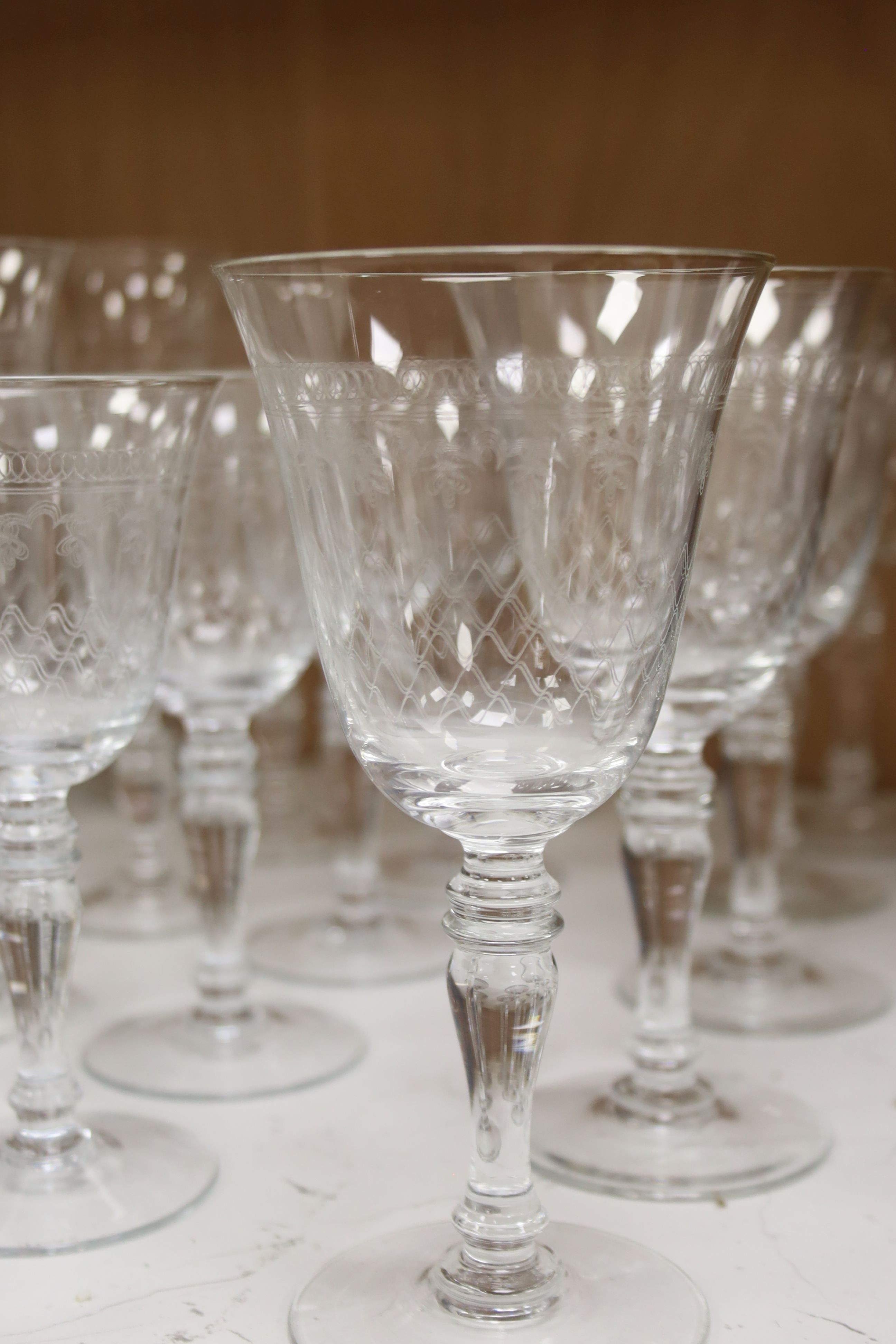 A suite of finely etched glassware, 23 pieces